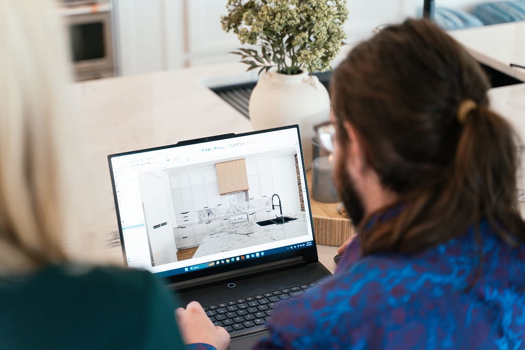 Maceon designing kitchen on laptop