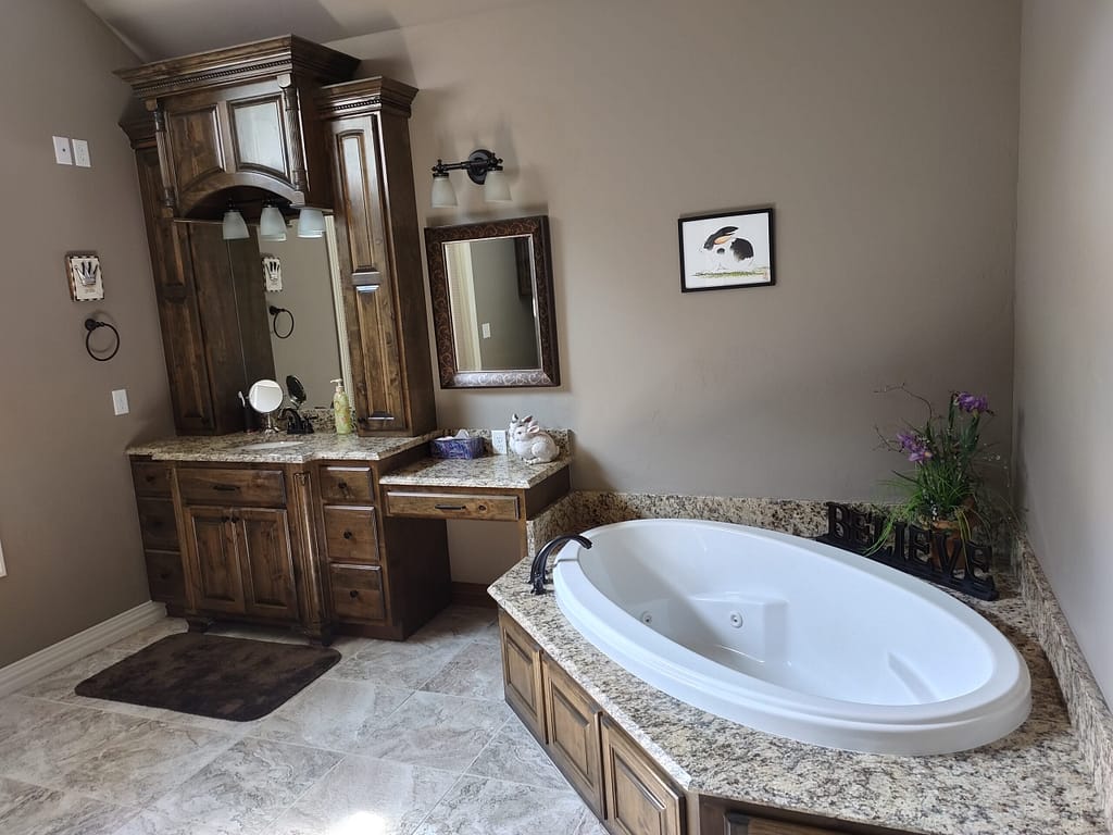 Bathroom with vanity and tub before remodel