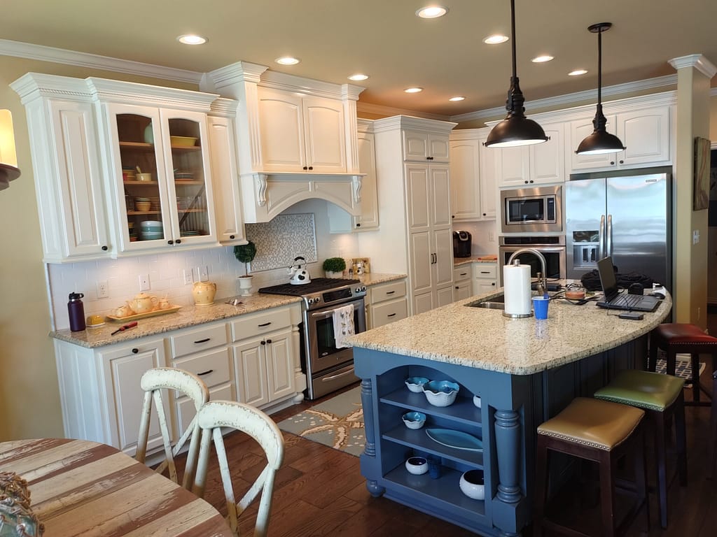 Large kitchen with blue island before remodel