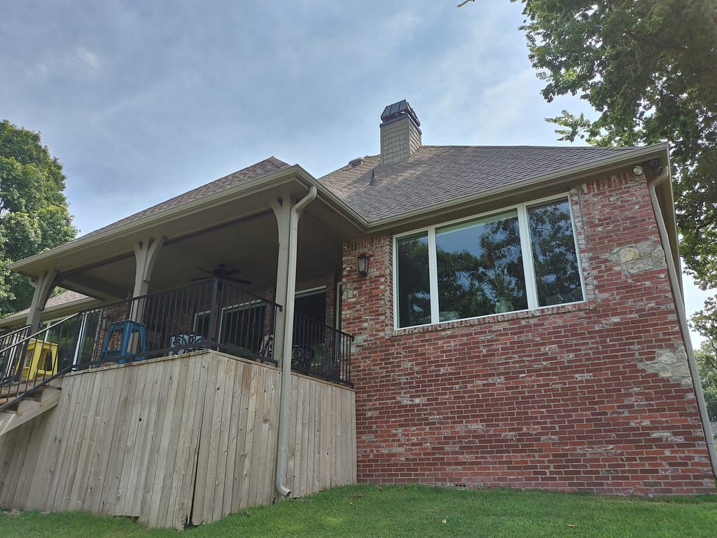 Back of home with deck before remodel