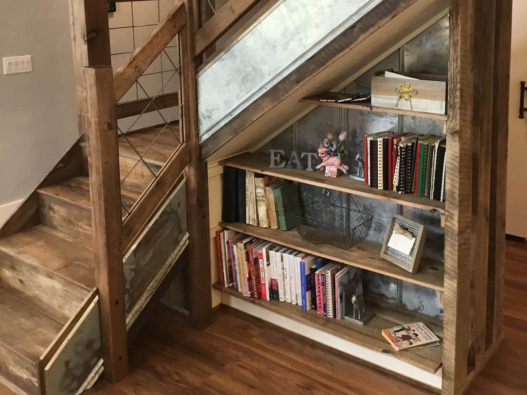 Bookshelf utilizing the space underneath stairs