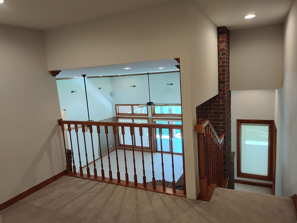 Balcony overlooking living room before remodel