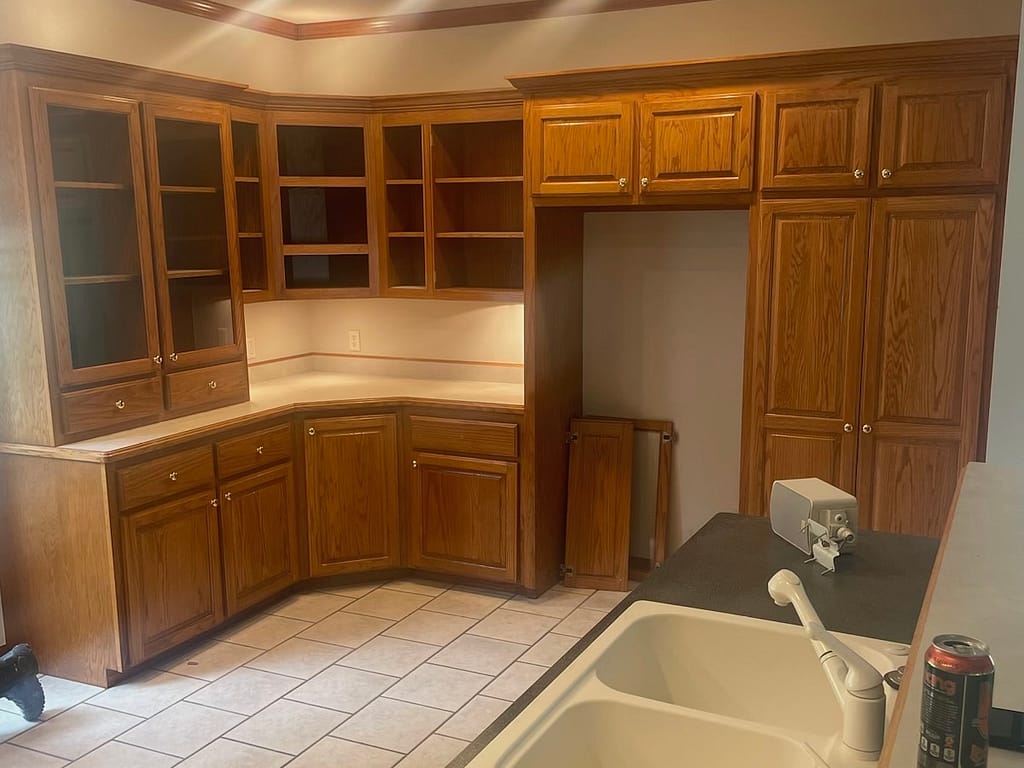 Kitchen with oak cabinets and island before remodel