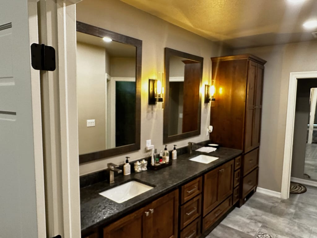 Master bath double vanity with sconces. above after remodel