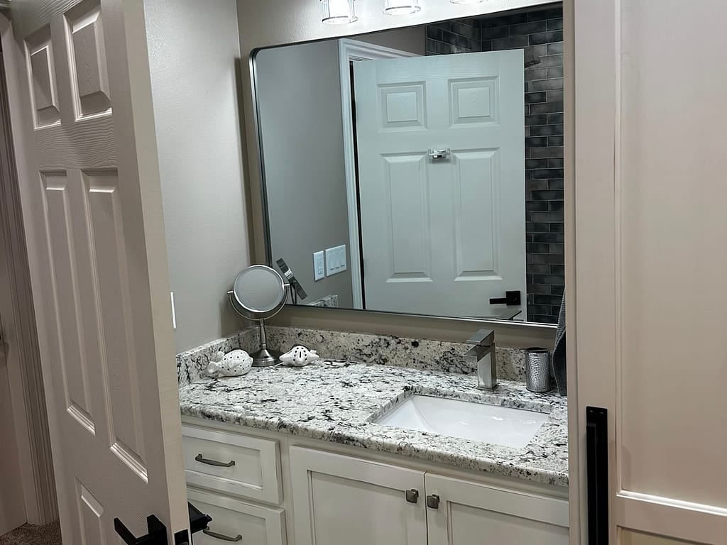 Bathroom with granite countertop after remodel