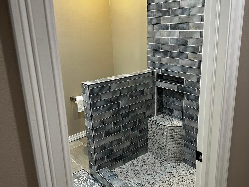 Bathroom added in place of balcony with shower after remodel