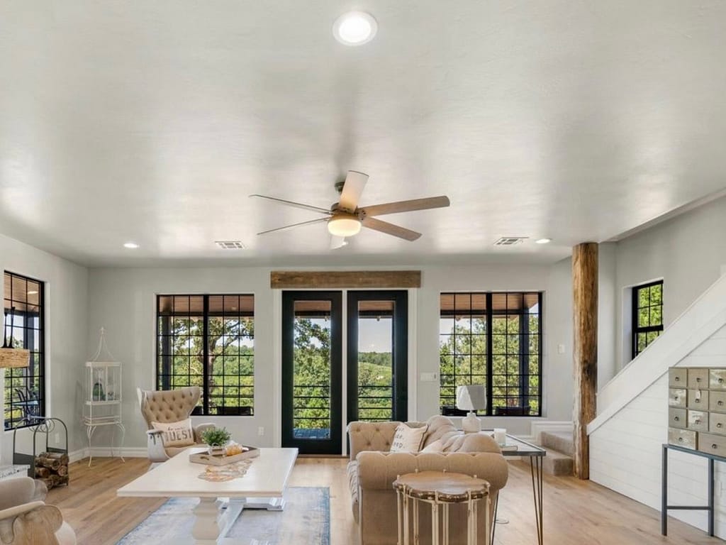 Large modern living room with doors to a deck