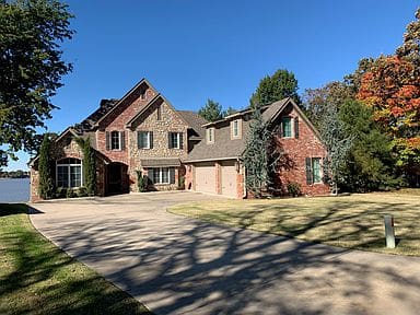 Large home with brick exterior before remodel
